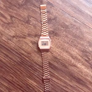 A rose gold Casio g shock watch old school style